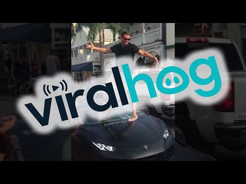 Moron Stands On His Car & Breaks Windshield Showing Off Car At Autopride Event