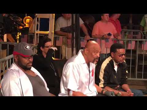 Stacey McKinley giving instructions to Carlos Monroe Jr.