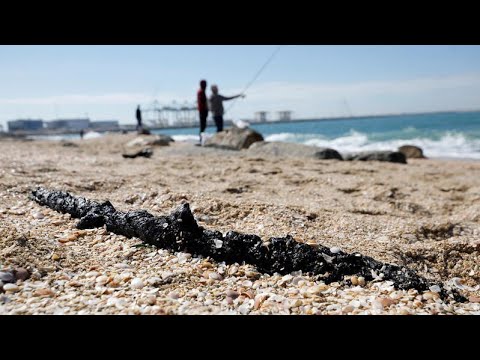 Israeli beaches hit by mystery oil spill