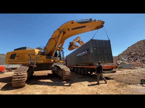 Two Liebherr Excavators 976 And 974 Loading Container On Truck