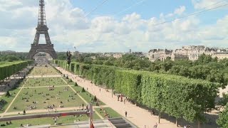 Daredevils zip-line off the infamous Eiffel Tower
