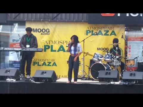 Joyce N'Sana and killer band Laying it right DOWN in the pouring rain