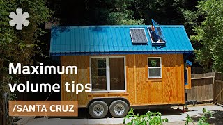 Tiny home packs storage stairs, 2 lofts, tub in 136 sq ft