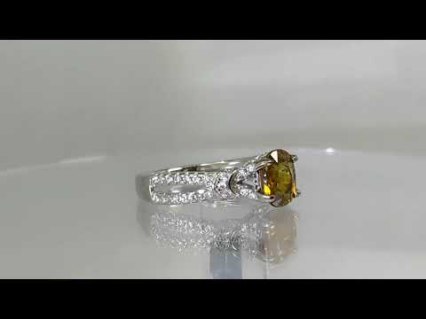 Серебряное кольцо с натуральным Brownish Yellow сфеном 1.24ct и фианитами. Размер 17.0