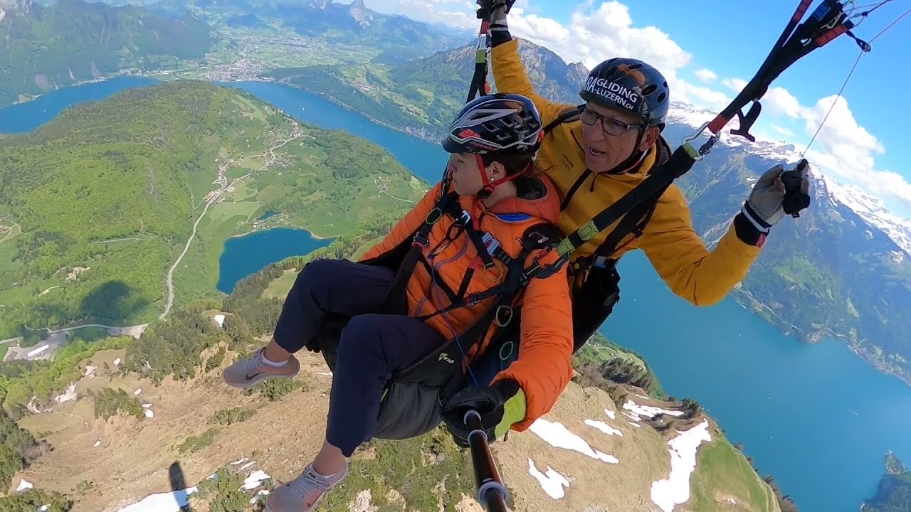 Capture panoramic views of the Swiss Alps and the serene Lake Lucerne with paragliding adventure.