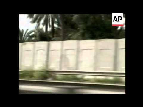 Iraqis gather in Baghdad to protest construction of a wll that is meant to keep Sunnis and Shiites a