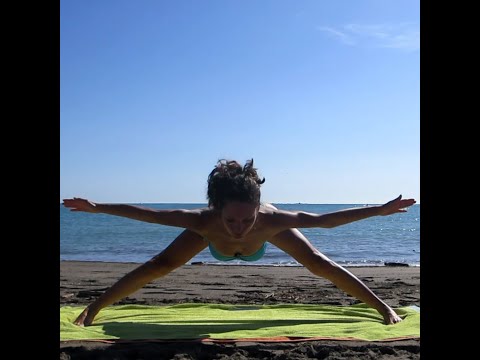 Stretching yoga at the beach in Italy