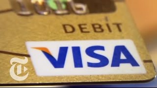 Business: The Card Game: Visa Reigns With Silent Tax | The New York Times