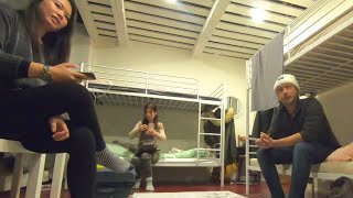 World Travelers Talking in a Hostel