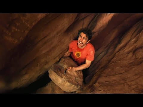 مغامر تنحصر ايده بين الصخور فلن يستطيع التحرك ويبقى بلا طعام لمدة خمسة ايام 127 hours