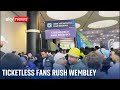 Ticketless supporters storm Wembley Stadium at Champions League final