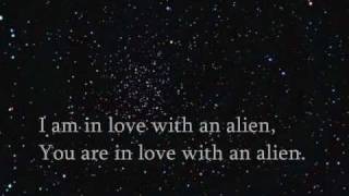 Ke$ha; aliens invading [lyrics on screen].