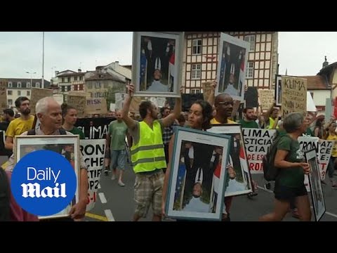 Critics of Emmanuel Macron march in a town near G7 summit