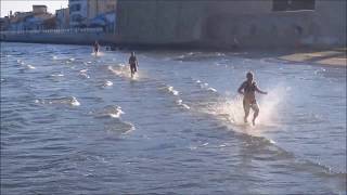 Girls runs over the sea - Larnaca, Cyprus