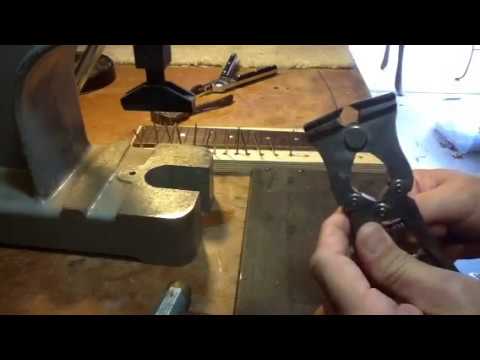 Installing fretwire on a bound fretboard