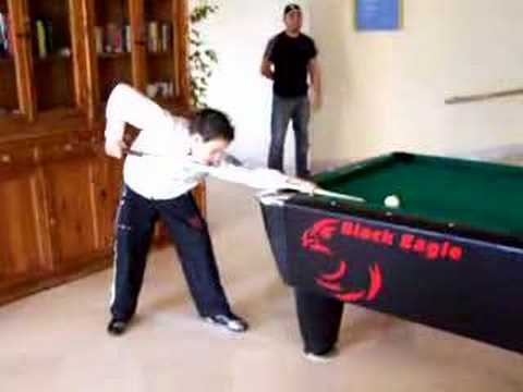 Pool trick shot with hat