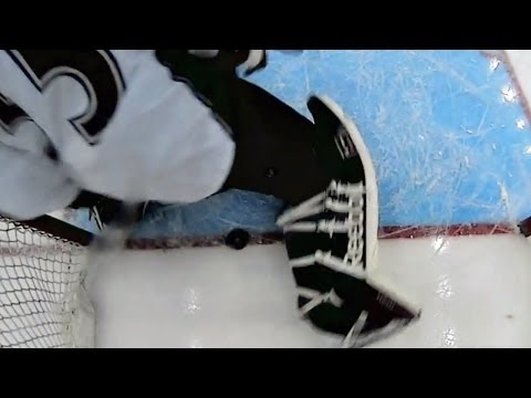 Jagr's shot sits on goal line behind Giguere