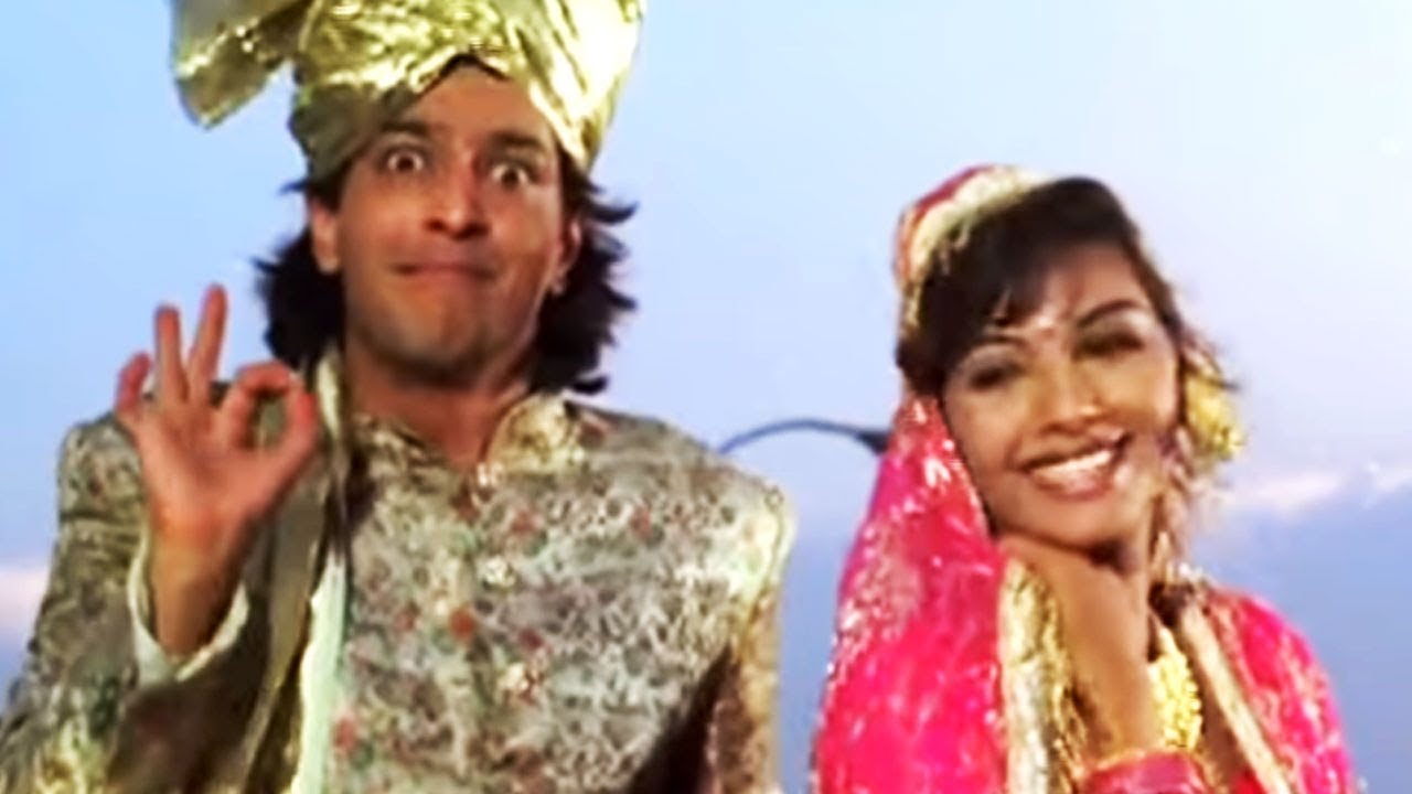 Band Bajega Dhol Bajega Lyrics | Teesra Kaun | Udit Narayan | Anand Milind