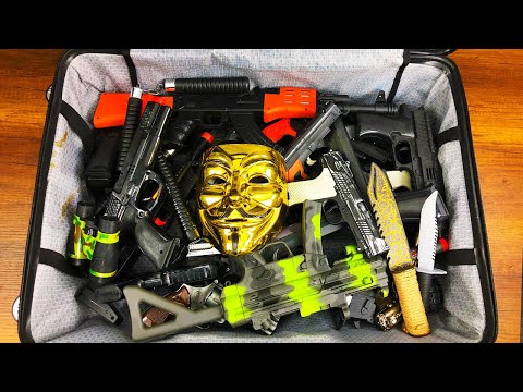 Suitcase full of Toy Guns - Bead Launch Guns - Real Karambit Knives - Gun Types and Equipments
