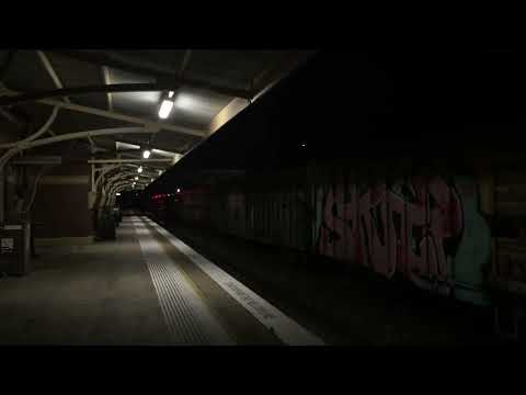 SCT 001 and SCT 002 on a mixed freight train passing Goulburn