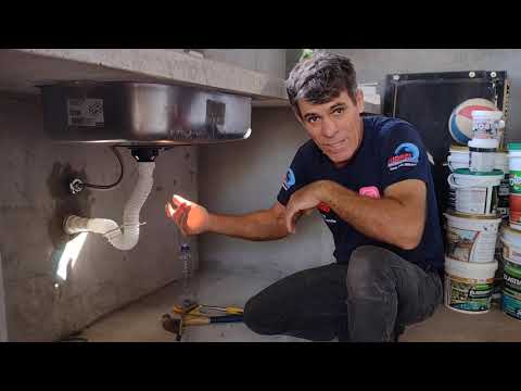 How to install a kitchen sink faucet and trap.