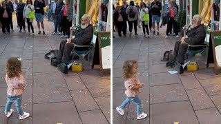 Little girl has the most hilarious reaction to busker signing Twinkle Twinkle'