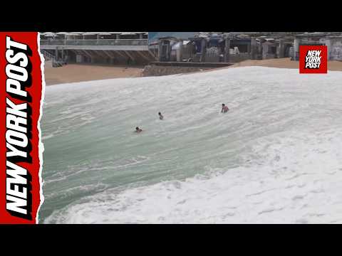 Drone video captures moment giant wave swallows up swimmers on Mexican beach