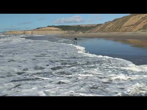 Nyssa running from waves Tunitas Creek Beach