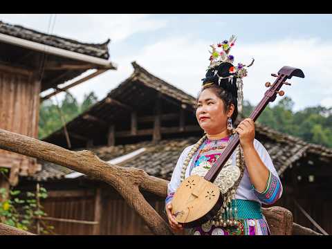 Ms Wu Xianliang from Huanggang Village in Guizhou, China performs 'Stars and Moon', a Pipa Song