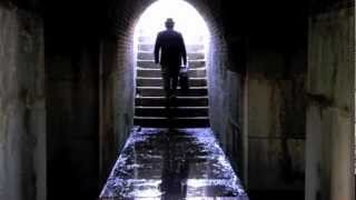 Run - Who is the man in the suit with the dark glasses?