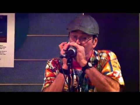 "Harmonica" Mike Handler jams with Mitch Woods in the gloom of the Westerdam piano bar.