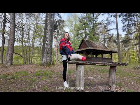 Amputee - casted stump relaxing by the lake with a girl
