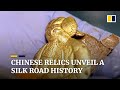 Relics unearthed from tomb in northwest China underscore county’s role as hub on ancient Silk Road