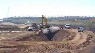 Komatsu PC1250 working on a massive trench