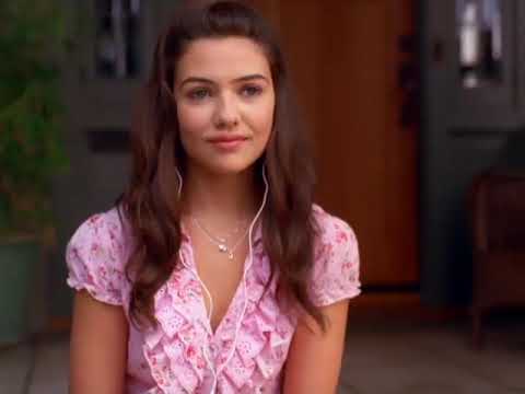 Trailer still: school gym dance lights and a mic stand — the apology performance setup