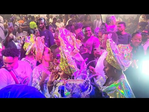 BETWEEN QUEEN MOTHER AND MERCY AIGBE ON THE STAGE AT MERCY AIGBE MOTHER'S BURIAL