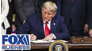 Trump participates in a signing ceremony in Oval Office