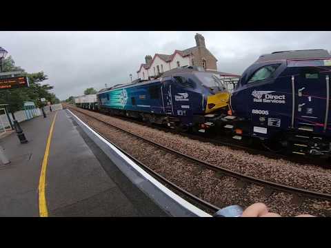 DRS 88005 and 88003 Pass Through Llanfair PG Station on Flask Duties 19/7/19 (Go Pro)