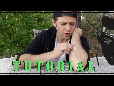 How to rub a coin into your arm magic trick tutorial -Julien Magic