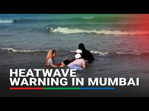 Indians head to the beach to cool down in sweltering heat