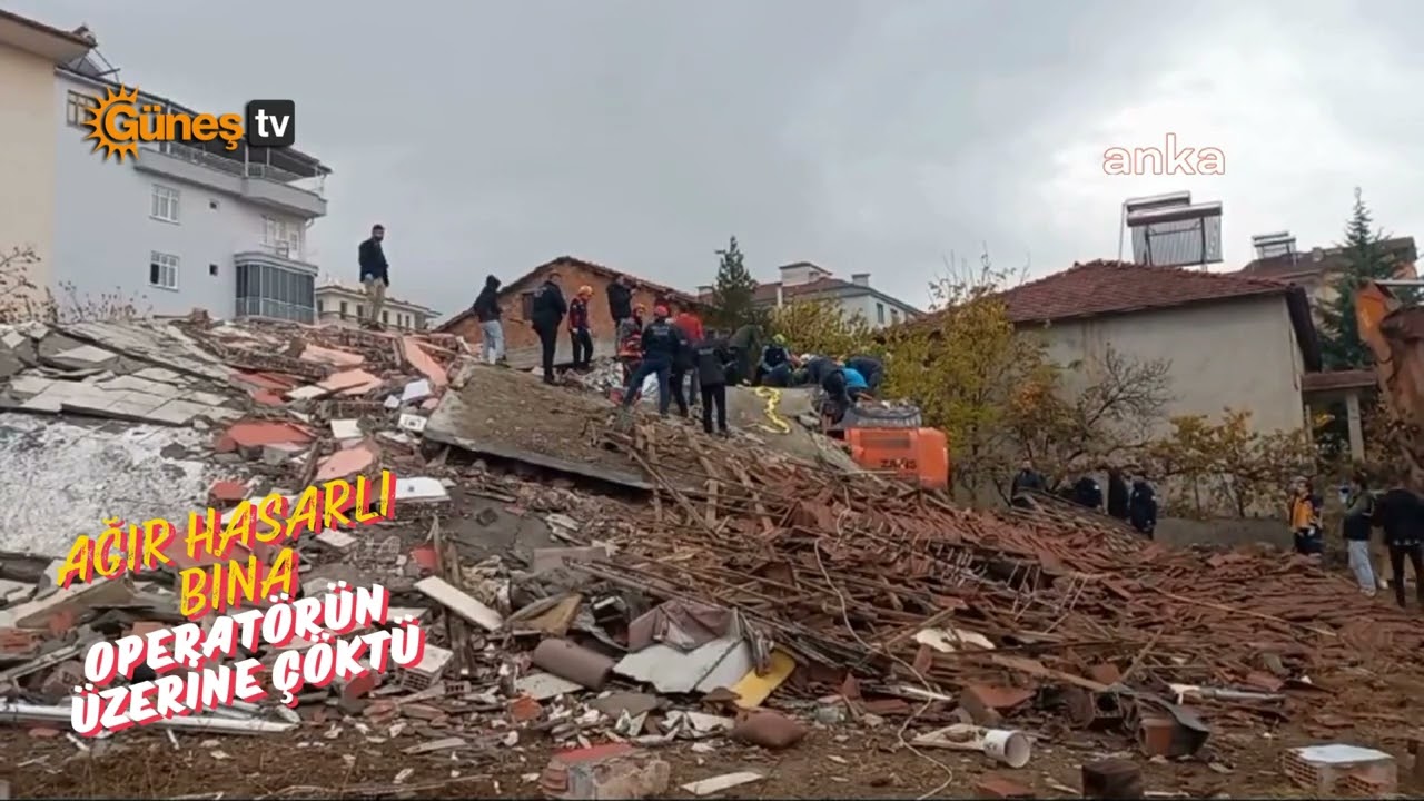 Ağır hasarlı bina operatörün üzerine çöktü