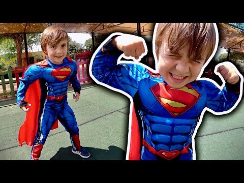 MARCOS PRETEND TO BE SUPERMAN AT THE KIDS PLAYGROUND