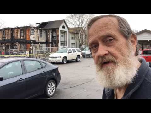 Early morning fire damages apartments, destroys cars