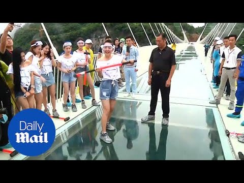 A brave few test the safety of China's newest glass bridge - Daily Mail