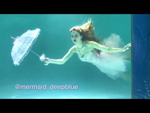 Mermaid and ballerina dancing underwater