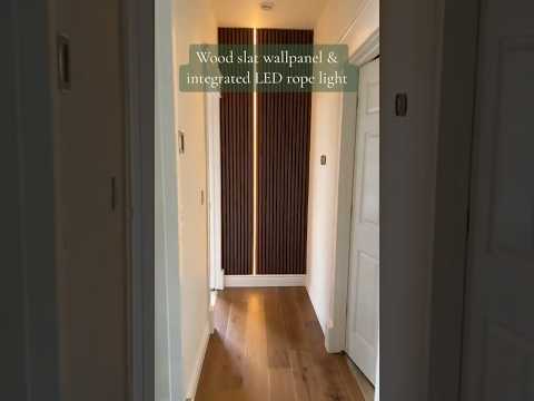 Wood wall paneling with integrated LED lighting.