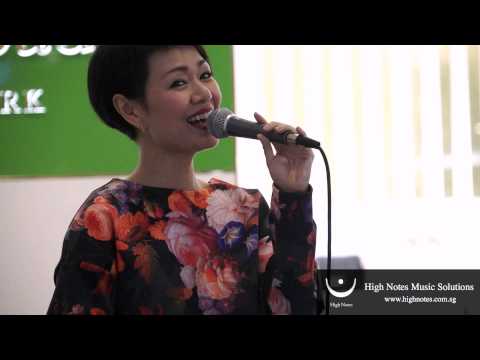 Joanna Dong performs vocal trumpet and sings 小城故事 Xiao Cheng Gu Shi at Raffles City Chinese New Year