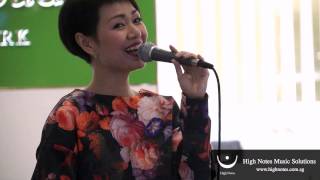 Joanna Dong performs vocal trumpet and sings 小城故事 Xiao Cheng Gu Shi at Raffles City Chinese New Year