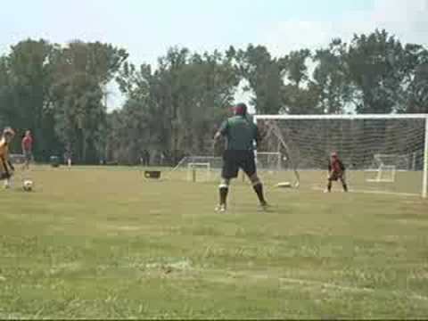 Benoit does the Maradona on a Macon United Player