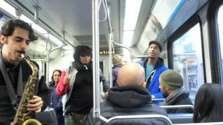 Jon Batiste & the Stay Human band play on the C-train in Downtown Calgary